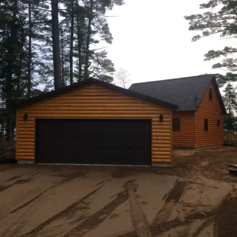 new log cabin and garage on lake in Upper Peninsula of Michigan