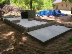 poured concrete frame for porch on side of house