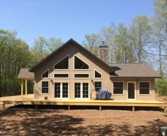 Custom build home with A-frame windows and large deck