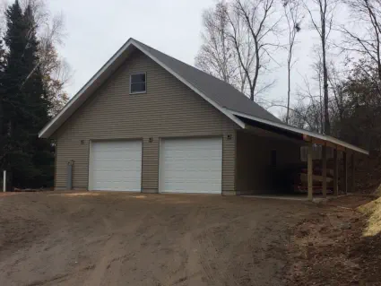 new two story custom build with gray siding and porch